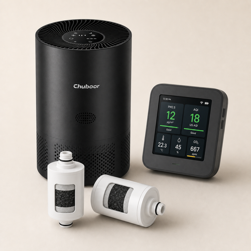 Complete Airward home reset kit with black room air purifier, PM2.5 monitor, inline shower filter and replacement cartridges on a warm eggshell background